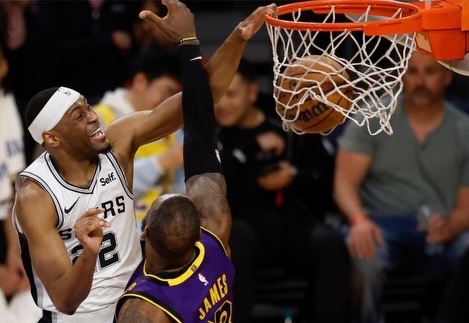 Basketball player mid-dunk
